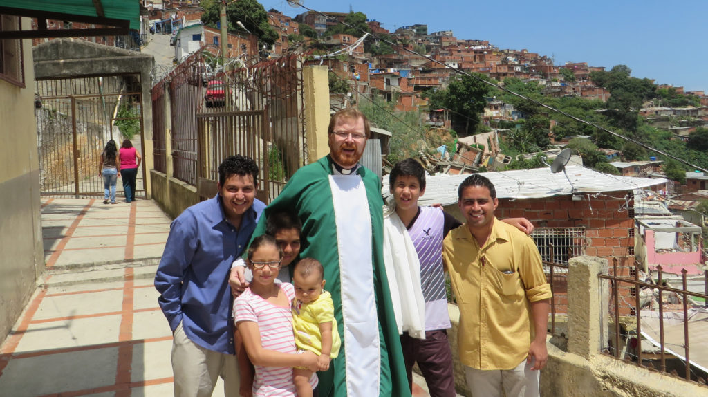 Fr Alan Neville MSC with local parishioners in Caracas, Venezuela.
