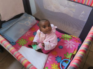 AIDS Orphans, a beautiful baby girl, one of the many children who live in the Holy Family Care Centre, Ofcolaco, South Africa.
