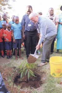 Matt Moran, formerly of the Missionaries of the Sacred Heart and Misean Cara, plants a tree on a mission project in Africa. Matt Moran, Missionaries of the Sacred Heart, Misean Cara, missionary work Africa, MSC Missions, Irish missionaries
