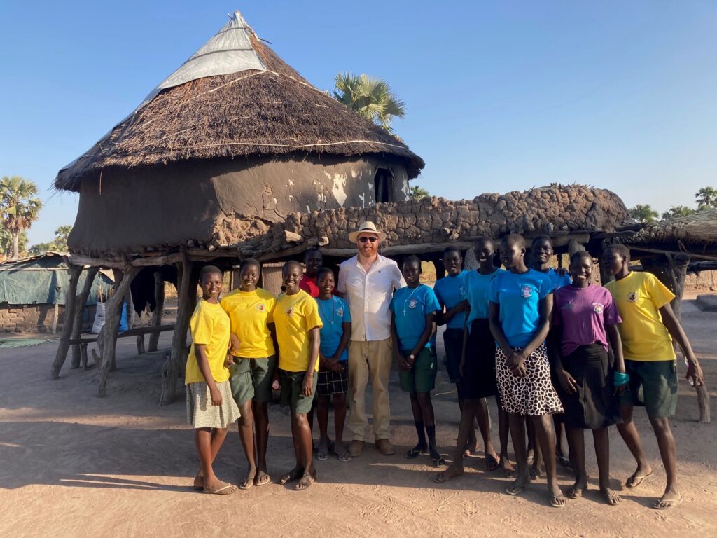 Mud huts in South Sudan with Fr Alan.