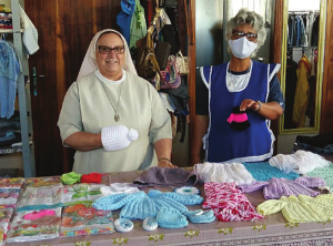 the sisters knitting and making clothes for the community