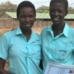 Two of the six female students graduating from the OLSH primary school in Mapuordit this year.