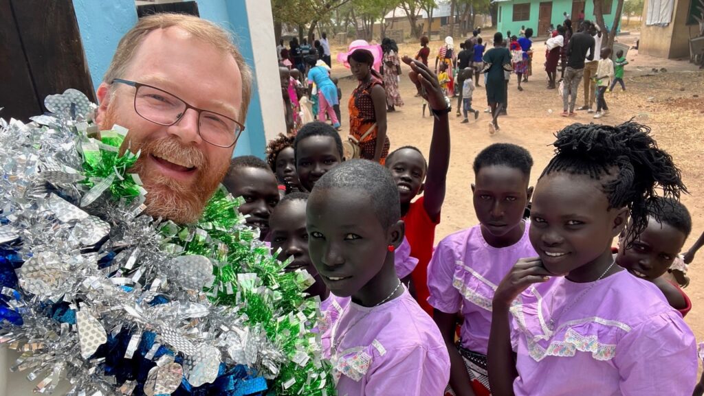 "[One] unique tradition they have there is to place a tinsel garland on the priest mid-baptism, so while I was busy anointing, I was being festooned like the prize bull at a cattle show." ~ Fr Alan recalls baptising twenty-two babies, in keeping with local tradition, on the Feast of the Holy Family on December 26th.
