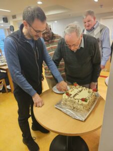 Fr Giacomo and Fr Jimmy cut the cake as the youngest and oldest members of the Chapter