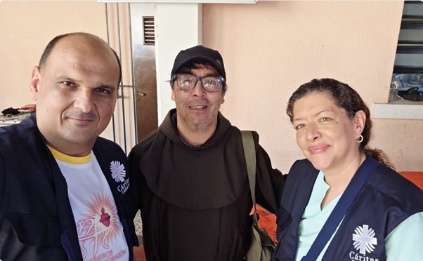 Pastoral Visit meeting with clergy and volunteers on the ground
