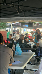 Preliminary screening and blood pressure measurements taken at the initial intake area.